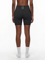 CLAiRE Women's High-Waisted Biker Shorts in Black, back view.