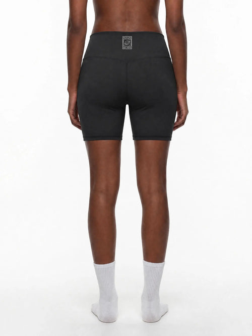 CLAiRE Women's High-Waisted Biker Shorts in Black, back view.