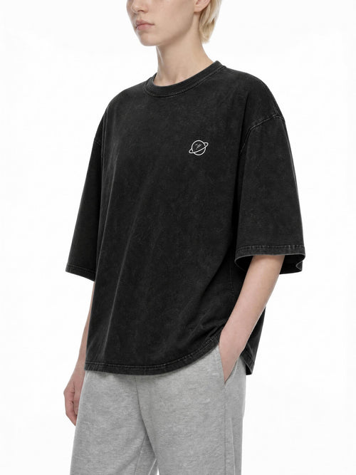 CLAiRE Snow Washed Oversized Cotton T-Shirt in Black, front three-quarter view.