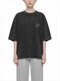 CLAiRE Snow Washed Oversized Cotton T-Shirt in Black, front view.