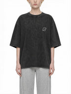 CLAiRE Snow Washed Oversized Cotton T-Shirt in Black, front view.