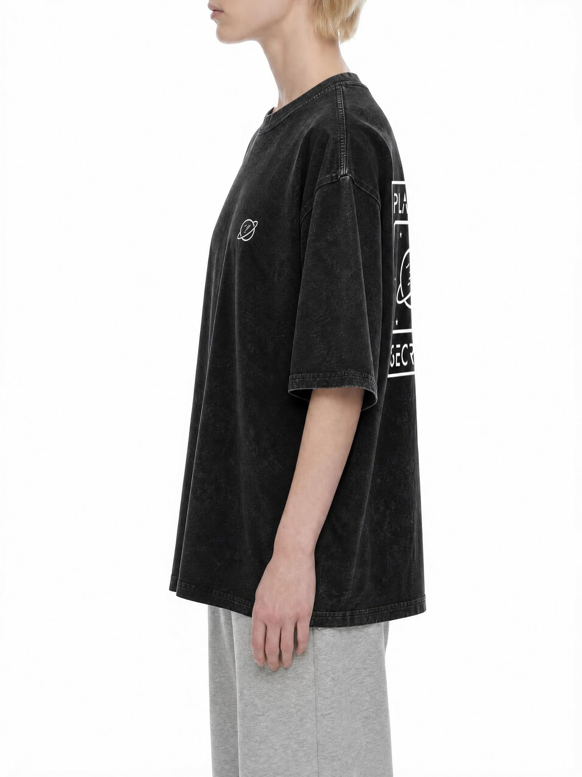 CLAiRE Snow Washed Oversized Cotton T-Shirt in Black, side view.