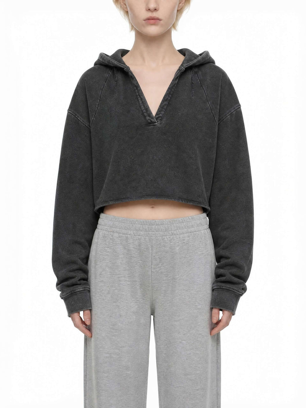 CLAiRE Vintage Washed Raw Edge Hoodie in Washed Black worn by a model, front view.