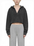 CLAiRE Vintage Washed Raw Edge Hoodie in Washed Black worn by a model, front view.