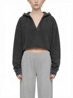 CLAiRE Vintage Washed Raw Edge Hoodie in Washed Black worn by a model, front view.