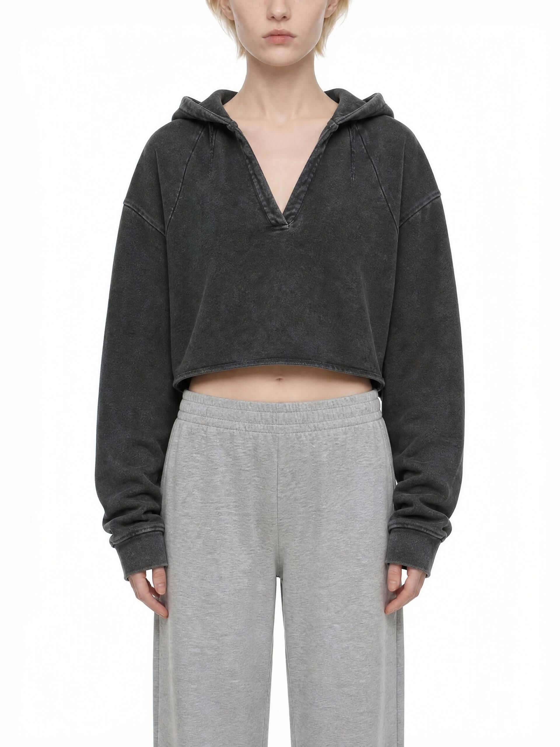 CLAiRE Vintage Washed Raw Edge Hoodie in Washed Black worn by a model, front view.