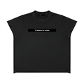 Merch in Town Boxy Raw Edge T-Shirt in Black on a white background, front view.