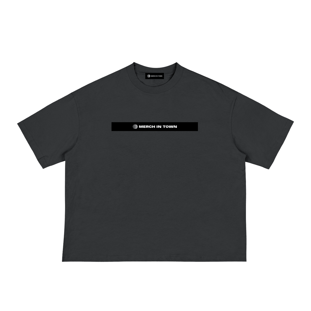 Merch in Town Classic Loose Boxy Tee in Black on a white background, front view.