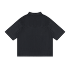 Merch in Town Vintage Wash Drop Shoulder Lyocell Shirt in Black on a white background, back view.