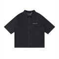 Merch in Town Vintage Wash Drop Shoulder Lyocell Shirt in Black on a white background, front view.