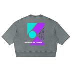 Merch in Town Mineral Wash Boxy Raw Edge T-Shirt in Gray Blue on a white background, back view.