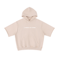 Merch in Town Mineral Wash Short Sleeve Hoodie in Apricot on a white background, front view.