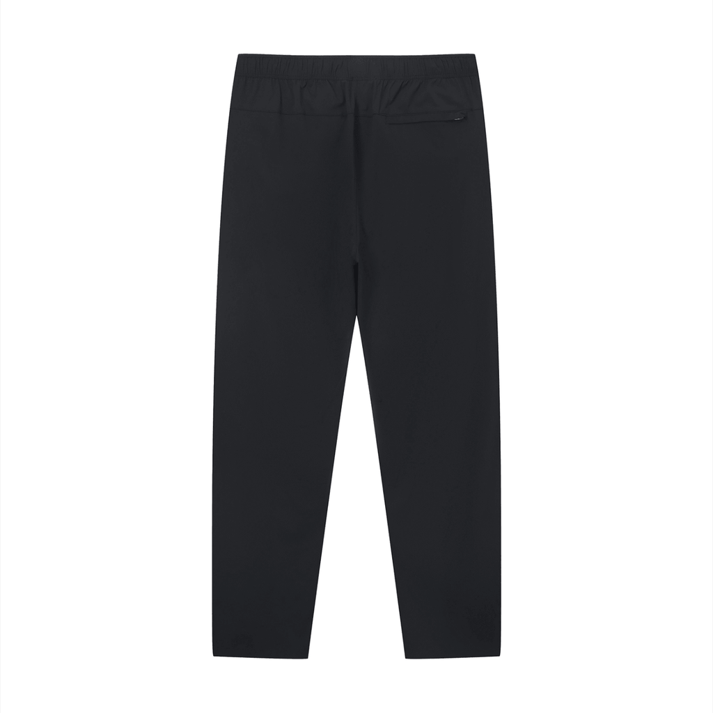 Merch in Town Lightweight Tapered Track Pants in Black on a white background, back view.