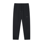 Merch in Town Lightweight Tapered Track Pants in Black on a white background, front view.