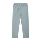 Merch in Town Lightweight Tapered Track Pants in Gray Blue on a white background, back view.