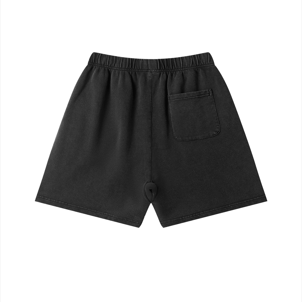 Merch in Town Vintage Wash Cotton Shorts in Black on a white background, back view.