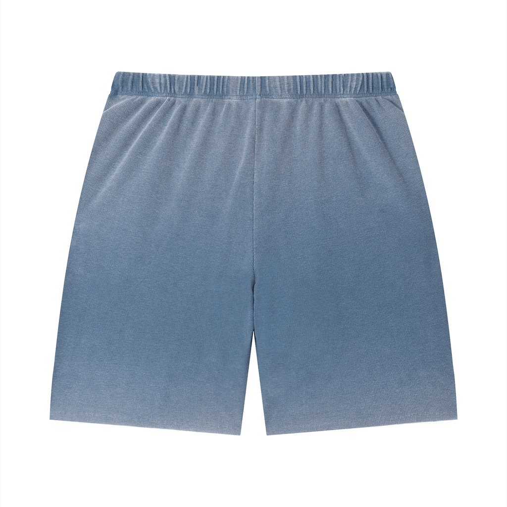 Merch in Town Vintage Wash Sunfade Waffle Raw Hem Shorts in Blue on a white background, back view.