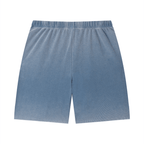 Merch in Town Vintage Wash Sunfade Waffle Raw Hem Shorts in Blue on a white background, back view.
