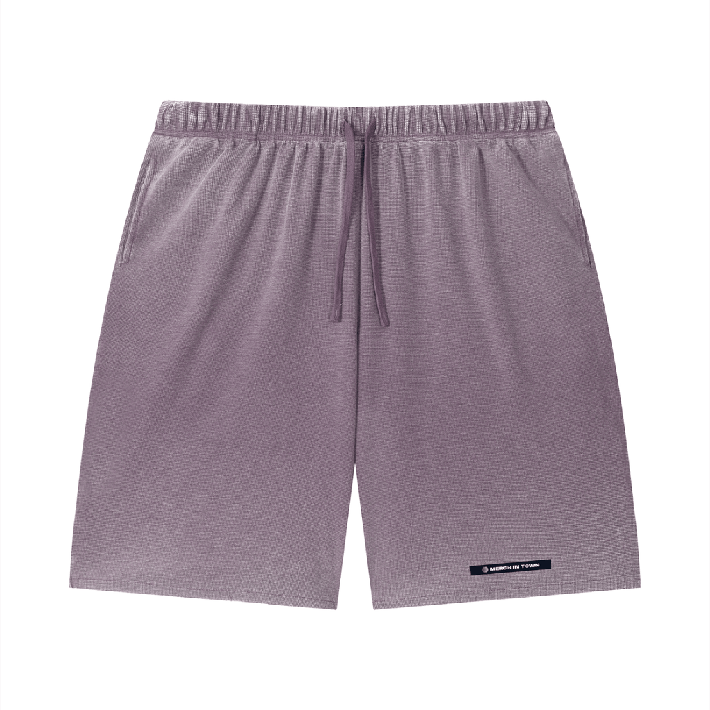 Merch in Town Vintage Wash Sunfade Waffle Raw Hem Shorts in Plum Purple on a white background, front view.