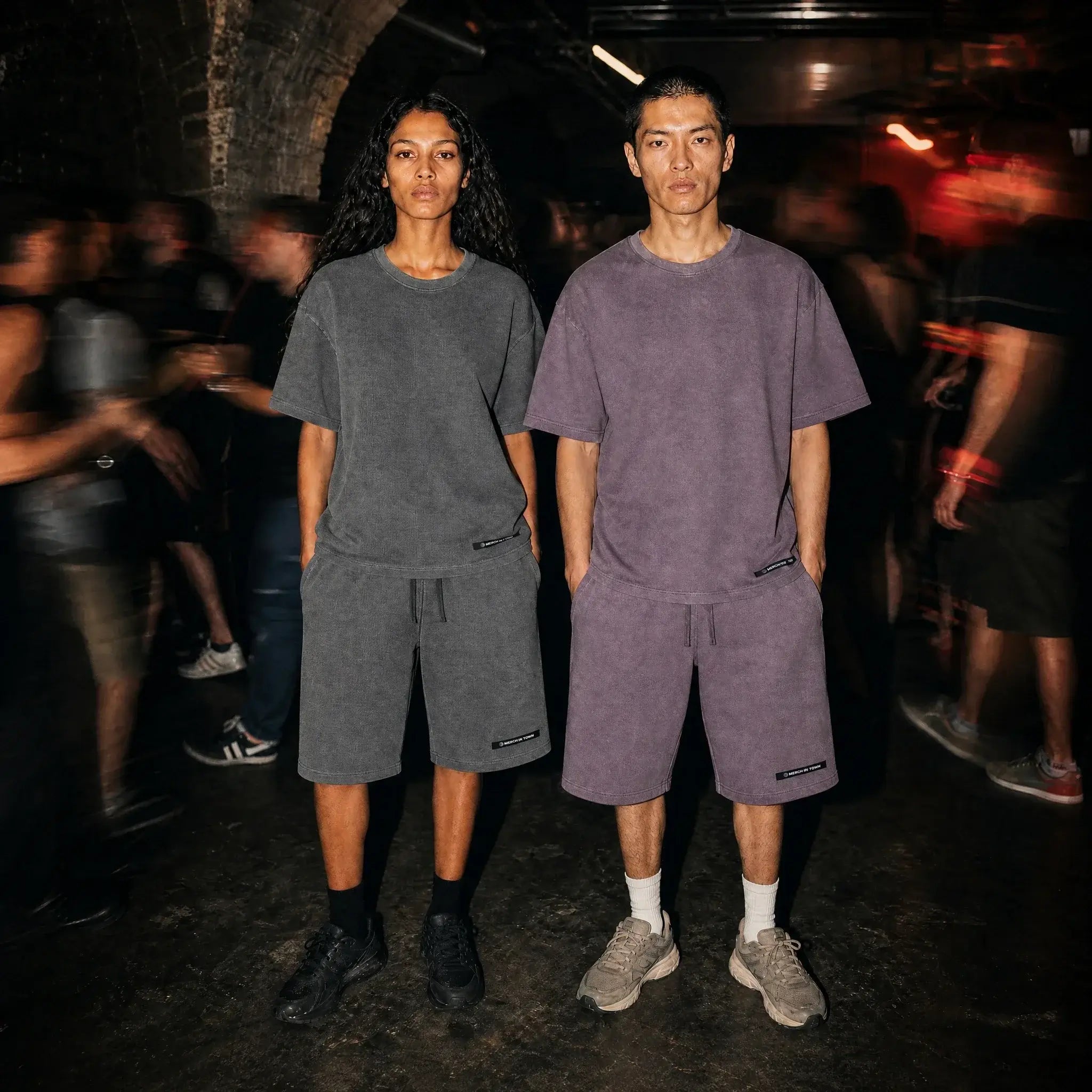 Merch in Town Vintage Wash Sunfade Waffle Raw Hem Shorts in Dark Gray and Plum Purple, two-model lifestyle shot