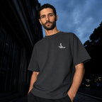 Salon Daomé dark grey Sorona quick-dry boxy t-shirt worn on an evening street, chest logo visible.