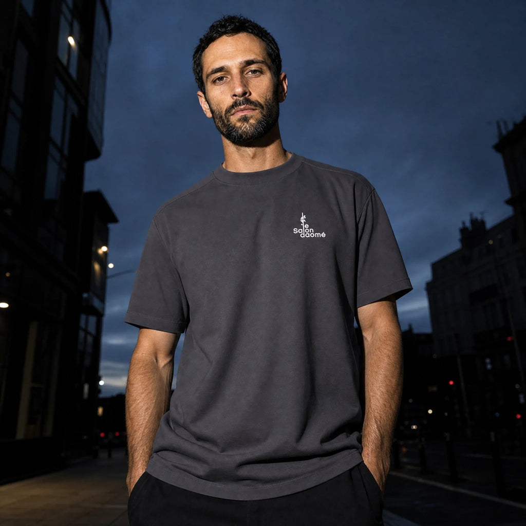 Salon Daomé dark purple Sorona quick-dry boxy t-shirt worn on a city street at night.