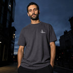 Salon Daomé dark purple Sorona quick-dry boxy t-shirt worn on a city street at night.