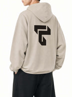 Teeto Boxy Gather-Hem Hoodie in Khaki worn by a model, back view with back logo.