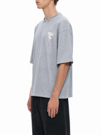 Teeto Mineral Wash Boxy Cotton T-Shirt in Light Gray worn by a model, front three-quarter view.