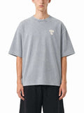 Teeto Mineral Wash Boxy Cotton T-Shirt in Light Gray worn by a model, front view.