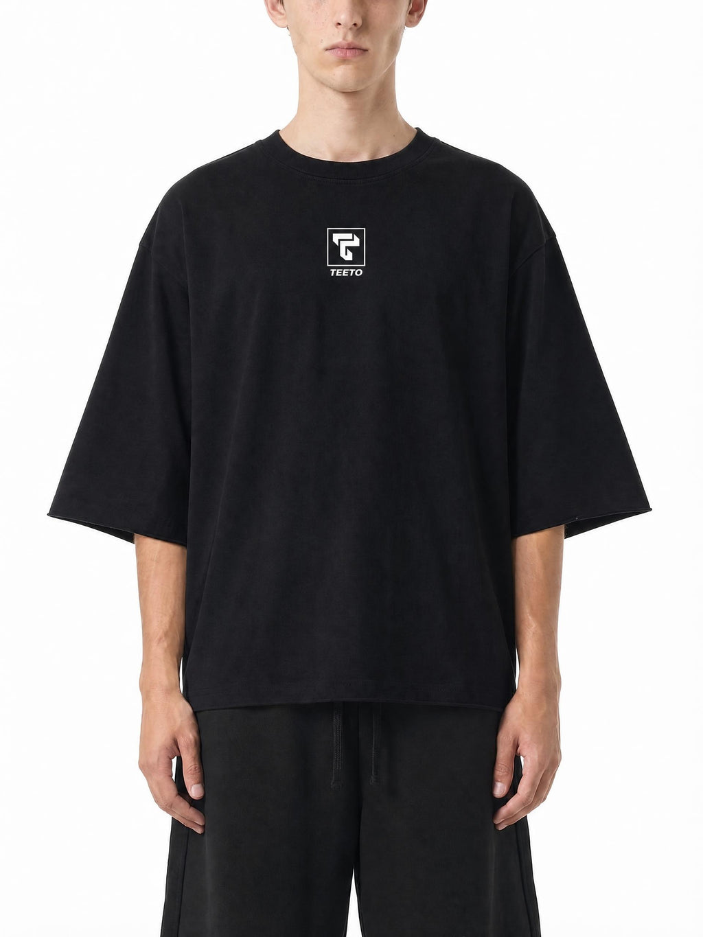Teeto Mineral Wash Raw Hem Boxy T-Shirt in Black worn by a model, front view.