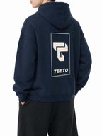 Teeto Oversize Fleeced Hoodie in Navy Blue worn by a model, back view with TEETO back logo.