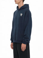 Teeto Oversize Fleeced Hoodie in Navy Blue worn by a model, front three-quarter view, alternate.