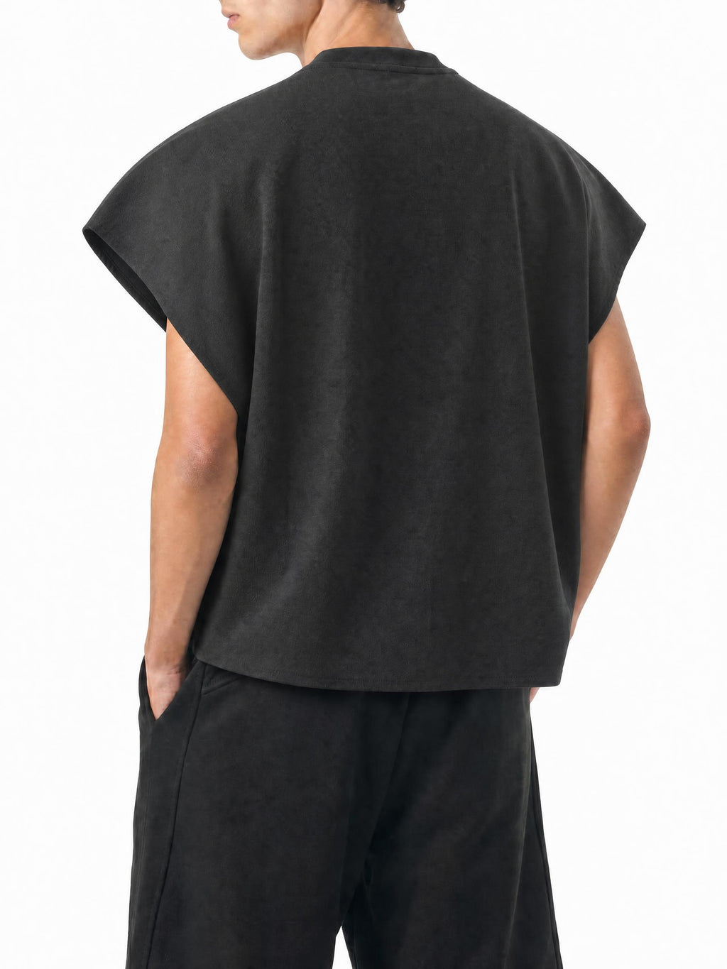 Teeto Raw Edge Boxy Non-Shrink T-Shirt in Black worn by a model, back view.
