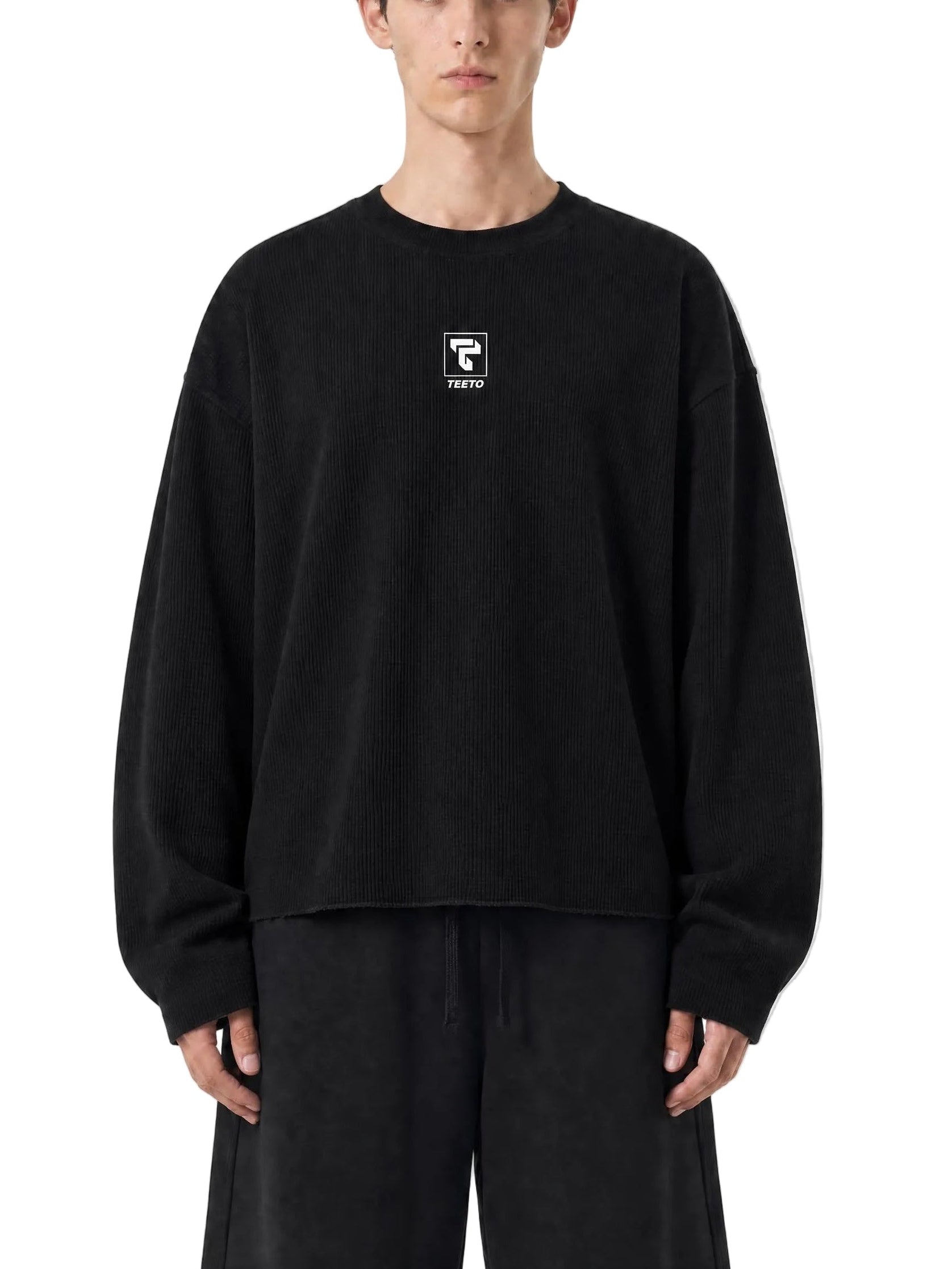 Teeto Waffle Raw Edge T-Shirt in Black worn by a model, front view.